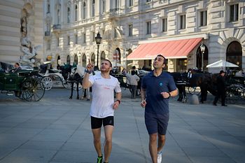 Two men jogging in the Vienna city center