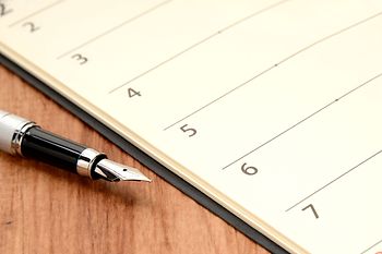 Calendar and fountain-pen