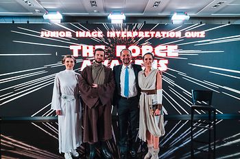 Four persons with Star Wars backdrop