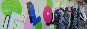 Groups sprays walls with Graffiti