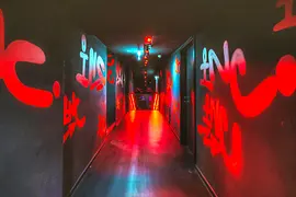 INC. Club Vienna hallway to staircase with graffiti
